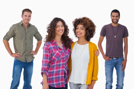 Fashionable young friends smiling at camerayoung  on white background