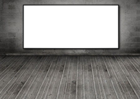 White copy space poster hung on a brick wall in an empty roomの写真素材