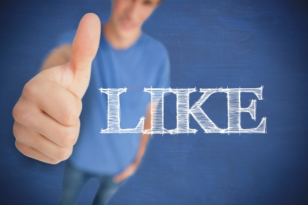 Man giving his thumb up next to the word like as a social network logoの写真素材