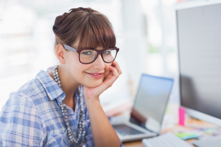Portrait of a designer working at her deskの写真素材