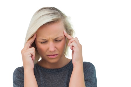 Attractive woman having a headache on white background