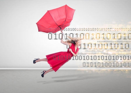 Woman flying in an empty room with binary code in backgroundの写真素材