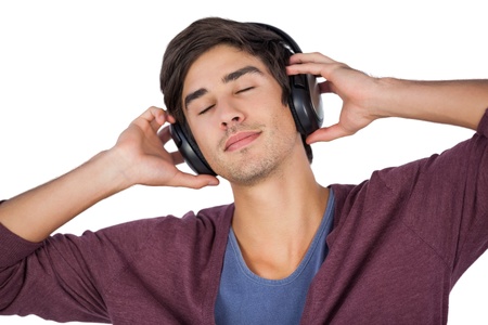 Man using headphones to listen music on a white background