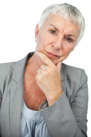 Thinking woman looking at camera on white backgroundの写真素材