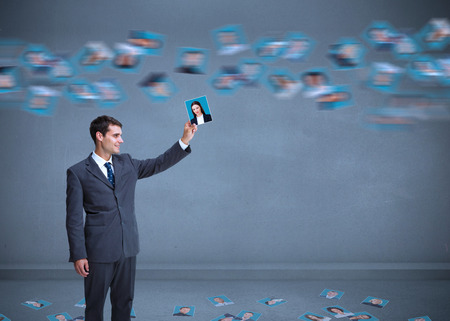 Stylish businessman catching profile picture from pictures whirlの写真素材