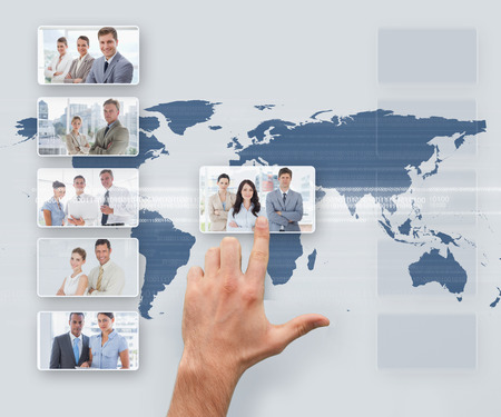 Hand selecting digital interface showing business people