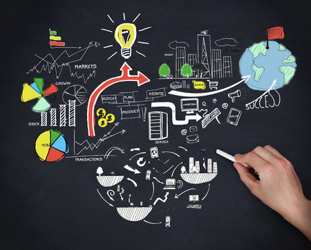 Picture of hand drawing colorful graphics on black paperの写真素材