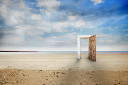 Picture of wooden open door on beachの写真素材