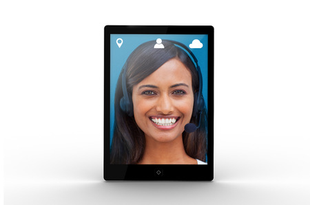 Digital tablet displaying cheerful businesswoman on white backgroundの写真素材