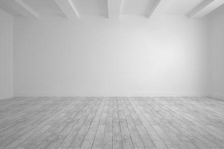 Big room with white wall and floorboardsの写真素材