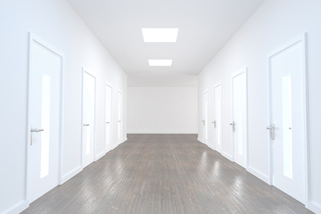 Bright hallway with several doors and wooden floorの写真素材