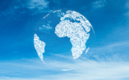 Digitally generated globe in skyの写真素材