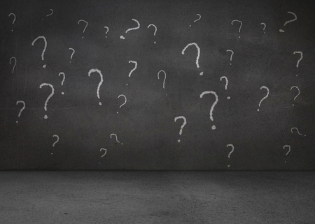 White question marks on grey wallの写真素材