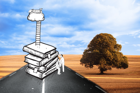 Two men climbing books over landscapeの写真素材