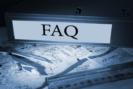 The word faq on blue business binder on a deskの写真素材
