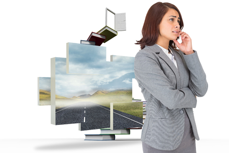 Worried businesswoman against steps made out of books with open doorの写真素材
