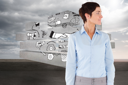 Woman looking at her right side against balcony and cloudy skyの写真素材