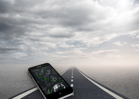 Brainstorm on smartphone screen against street under cloudy skyの写真素材