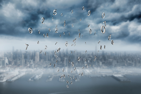 Silver numbers against coastline and cityの写真素材