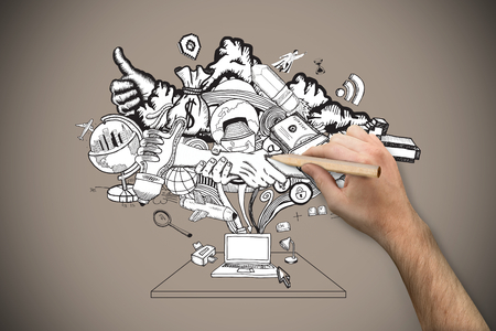 Hand holding a pencil against grey background with vignetteの写真素材