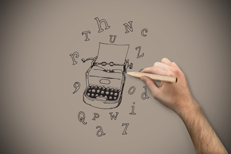 Hand holding a pencil against grey background with vignetteの写真素材