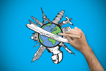 Hand holding a pencil against blue background with vignetteの写真素材