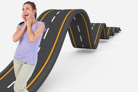 Young female surprised against bumpy road backgroundの写真素材