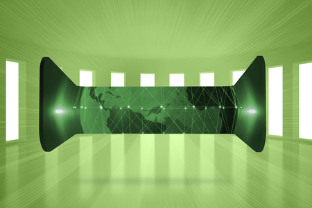 Green earth on abstract screen against bright green room with windowsの写真素材