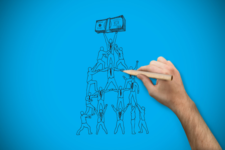 Hand holding a pencil against blue background with vignetteの写真素材