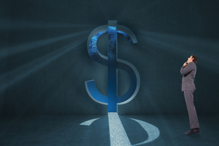 Thinking businessman with hand on chin against dollar sign door の写真素材