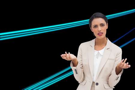 Composite image of confused businesswoman standing over white backgroundの写真素材