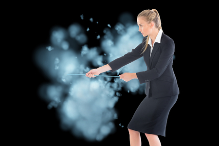 Composite image of blonde businesswoman pulling a ropeの写真素材