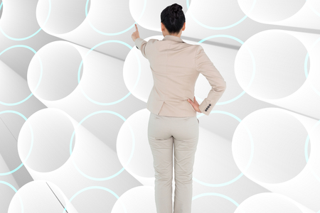 Composite image of asian businesswoman pointingの写真素材