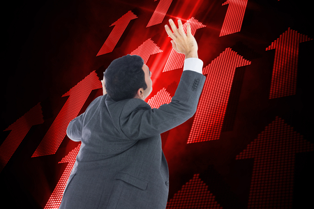 Composite image of businessman with arms raisedの写真素材