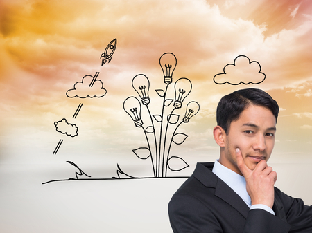 Composite image of thoughtful asian businessman pointingの写真素材