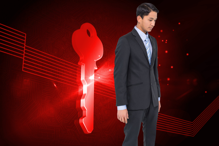 Composite image of serious asian businessman の写真素材