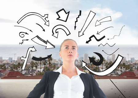 Composite image of blonde businesswoman standing with hands on hipsの写真素材