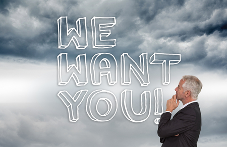 Composite image of thoughtful mature businessman posing on white backgroundの写真素材