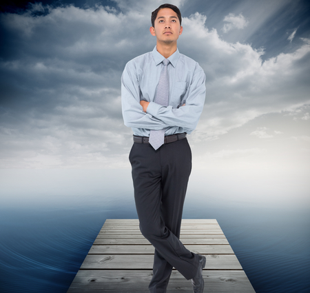 Composite image of serious asian businessman の写真素材