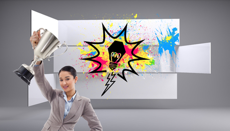 Composite image of portrait of a businesswoman showing a cupの写真素材