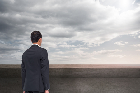 Composite image of businessman turning his back to cameraの写真素材
