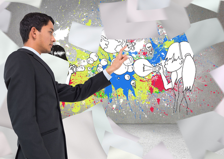 Composite image of serious asian businessman pointingの写真素材