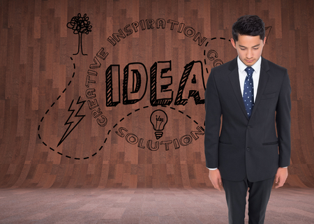 Composite image of serious businessman looking downの写真素材