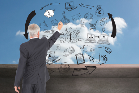 Composite image of rear view of serious businessman standing and writingの写真素材