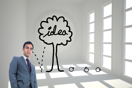 Composite image of unsmiling businessman standingの写真素材