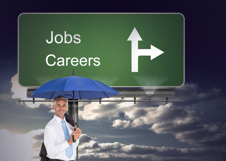 Composite image of businessman holding umbrella smiling at cameraの写真素材
