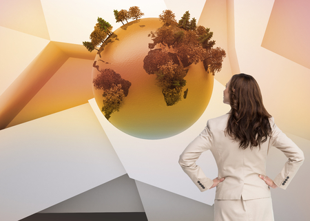 Composite image of businesswoman standing back to camera with hands on hips