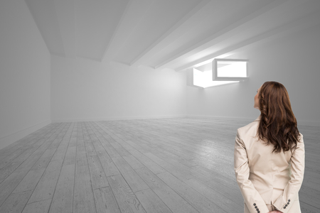Composite image of rear view of businesswoman looking awayの写真素材