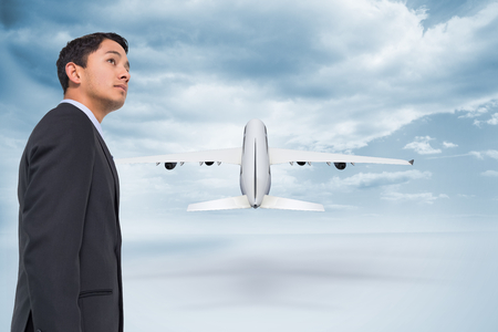 Composite image of serious asian businessman の写真素材