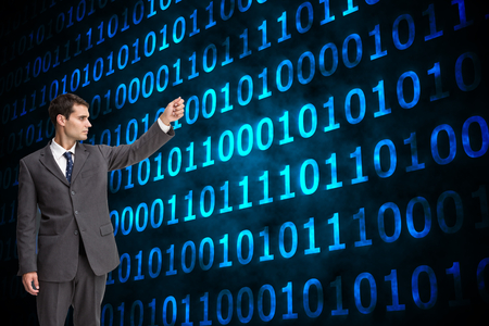 Composite image of stern attractive businessman pointingの写真素材